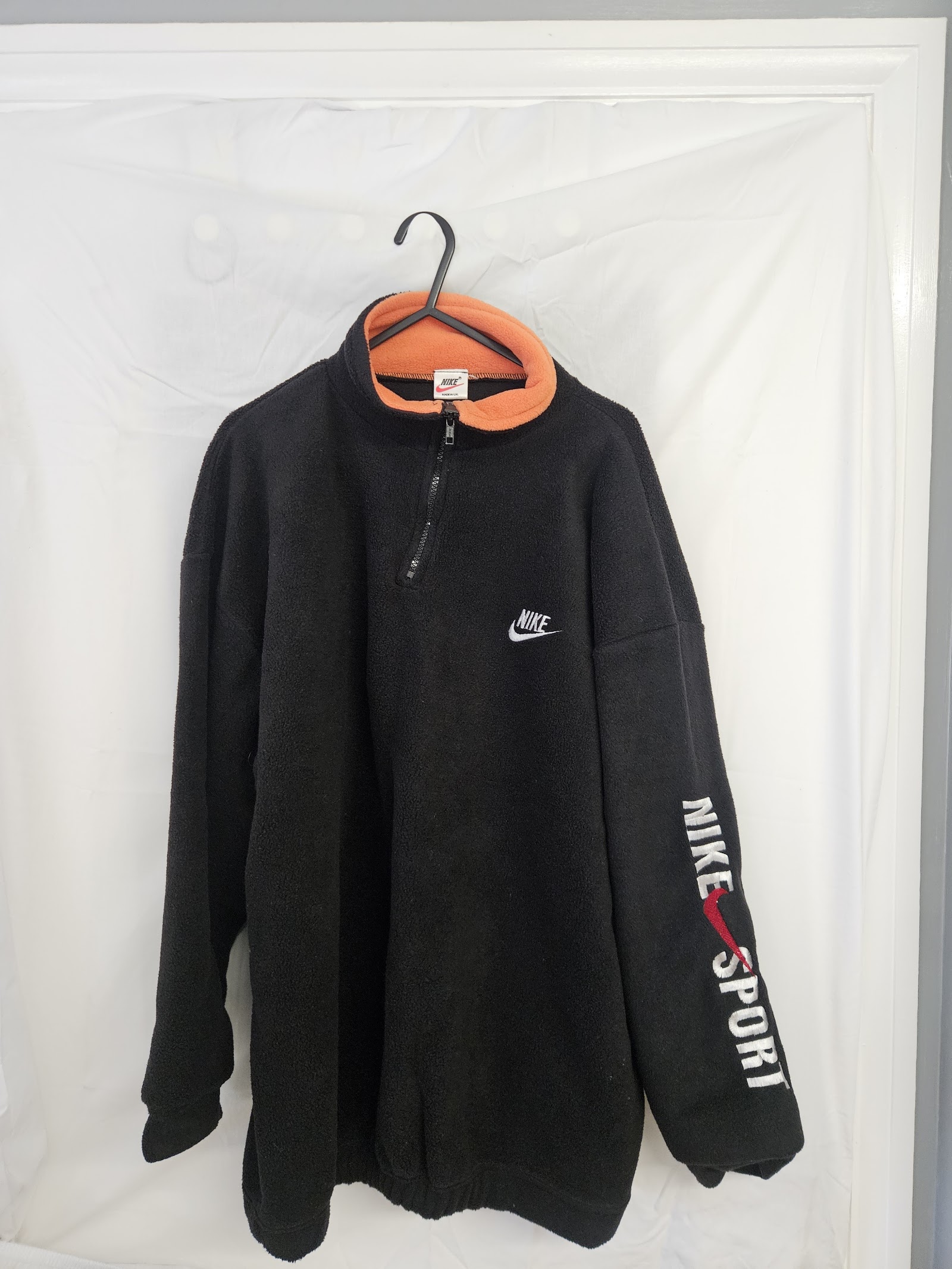 Nike Sportswear Black fleece quarter-zip with orange collar