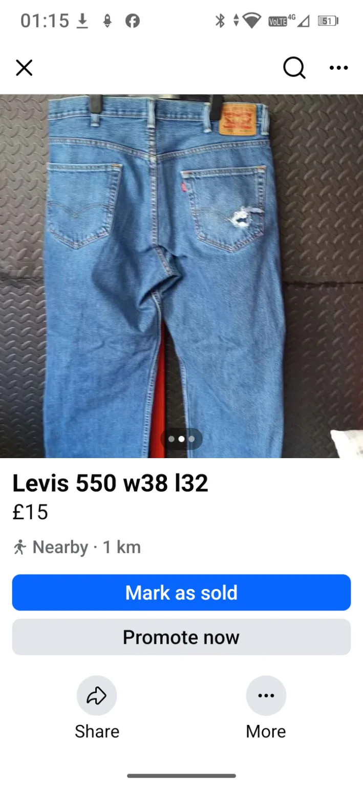 Levi’s 550 blue jeans with distressed pocket